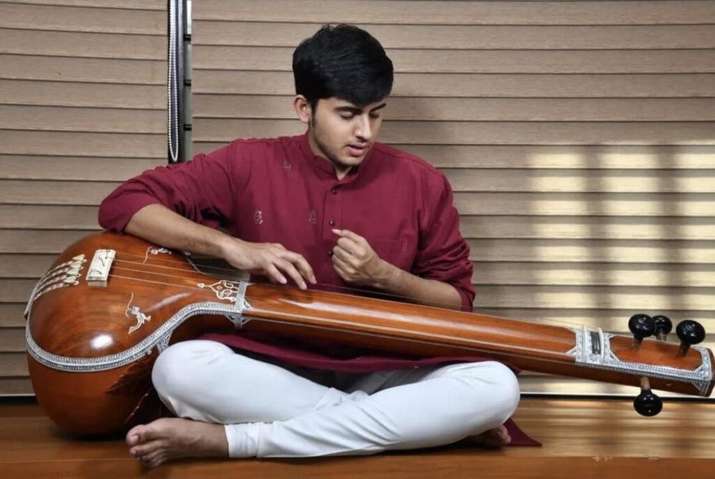 Aniruddh Aithal practising riyaz seated with a tanpura