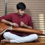 Aniruddh Aithal practising riyaz seated with a tanpura