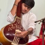 Aniruddh Aithal tuning a tanpura before a Hindustani classical recital