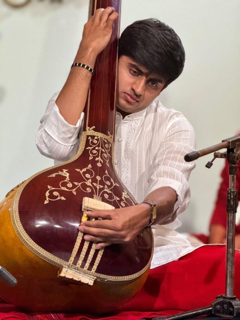 Aniruddh Aithal tuning a tanpura before a Hindustani classical recital